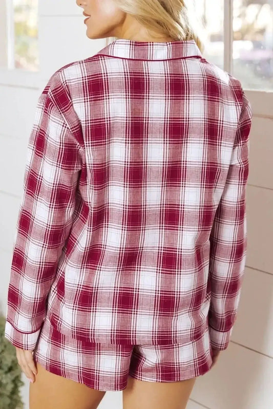 Woman wearing cozy red and white plaid long sleeve pajama top and shorts set
