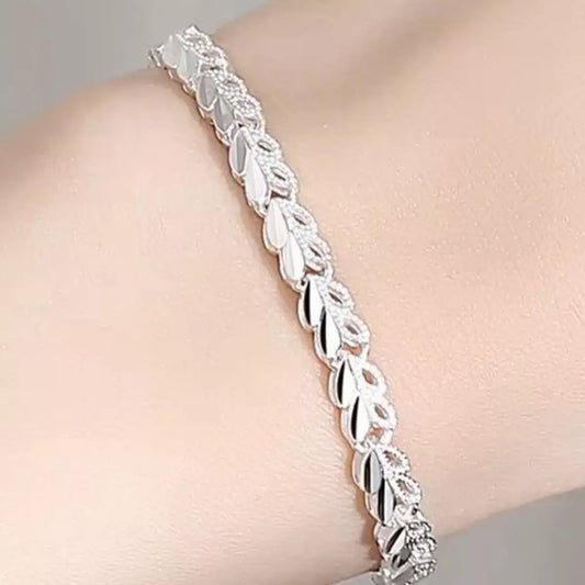Trendsi 925 sterling silver heart link bracelet worn on a woman's wrist.