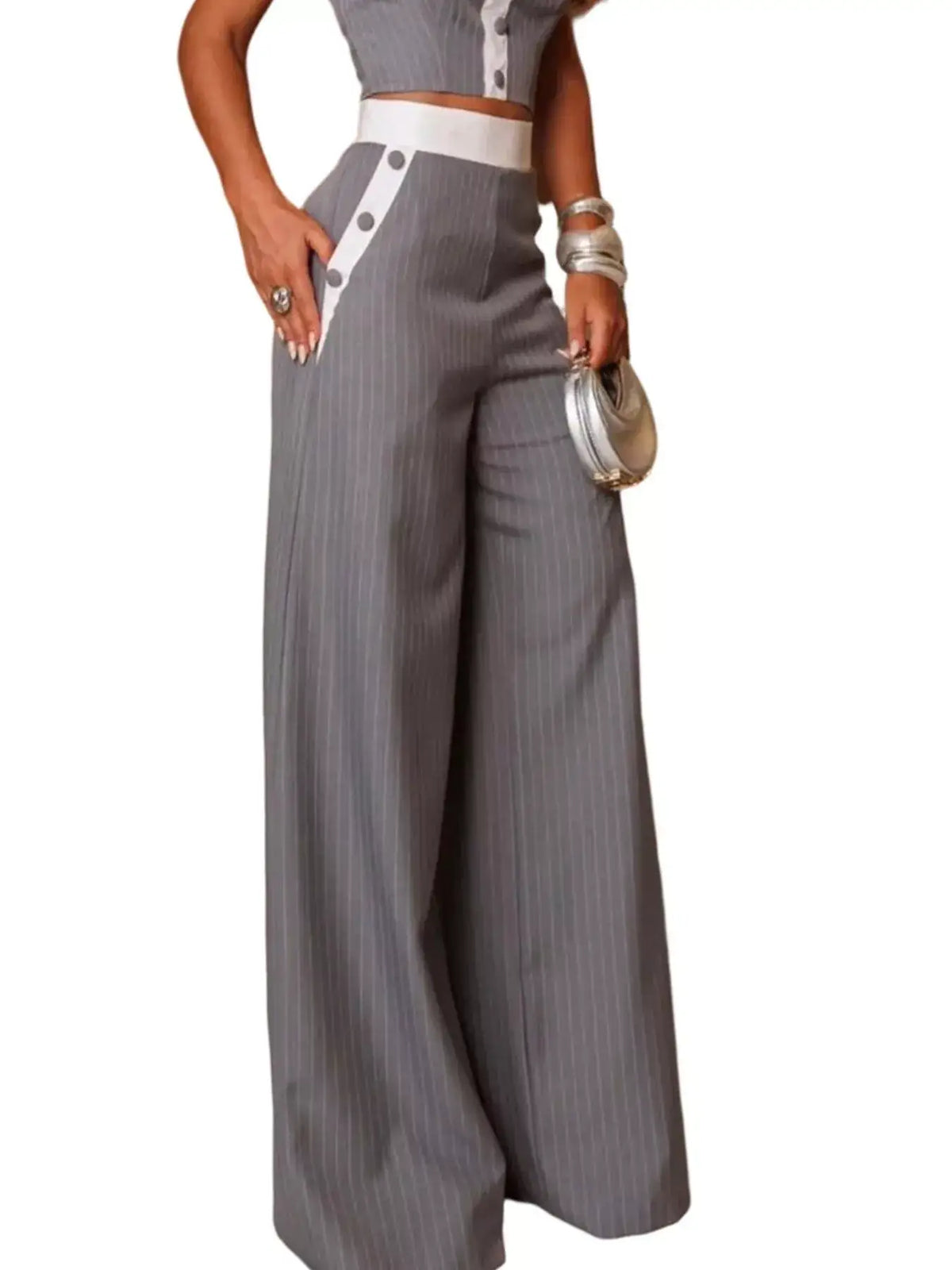 Evie's Dreamland grey pinstripe wide-leg pants with white waistband and button details.