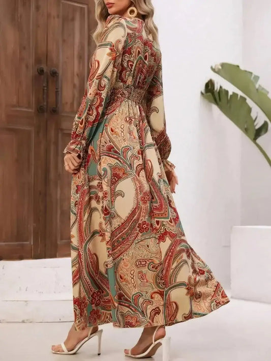 Woman wearing smocked printed V-neck dress with flounce sleeves in elegant boho style
