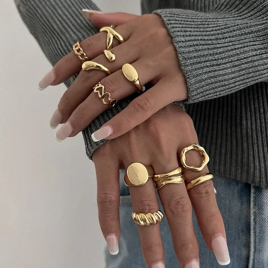 Stylish gold rings set for women, trendy layered fashion jewelry with unique designs and elegant finish.