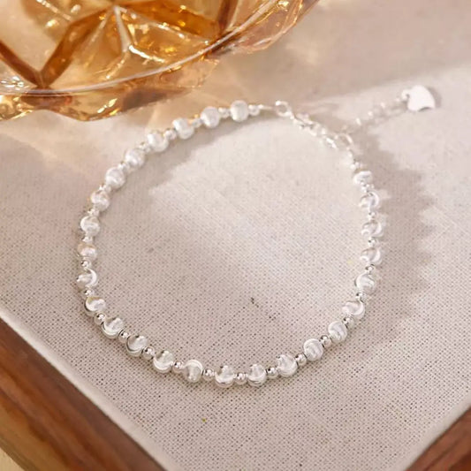 Trendsi 925 sterling silver beaded bracelet for women resting on a neutral fabric surface.
