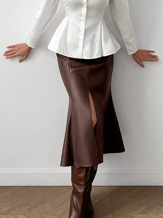 Brown faux leather slit mermaid midi skirt by Evie's Dreamland paired with a white peplum top and brown boots.