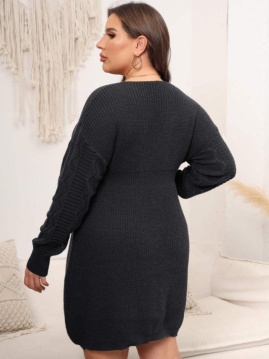 Back view of a woman wearing a dark grey long-sleeve knit sweater dress