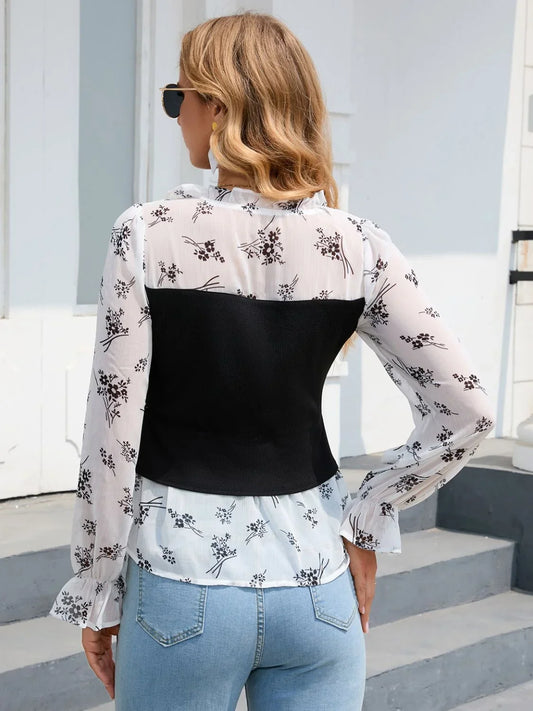 Black and white floral flounce-sleeve V-neck blouse, front view