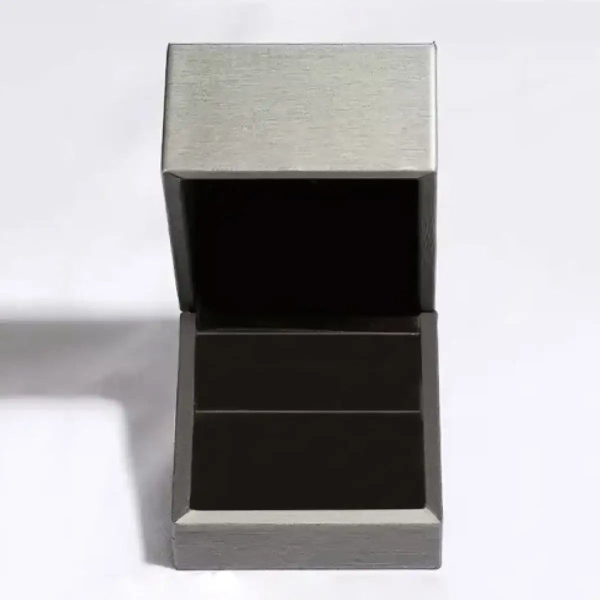 An open grey velvet jewelry gift box with a black interior from Evie's Dreamland.