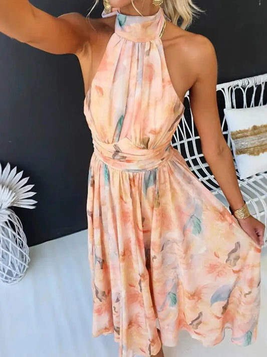 Peach floral halter neck backless midi dress for wedding guests by Evie's Dreamland