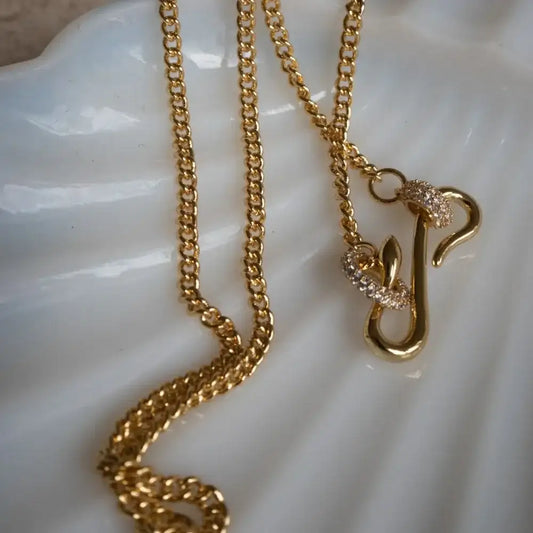 Dainty cubic zirconia gold necklace close-up of pendant