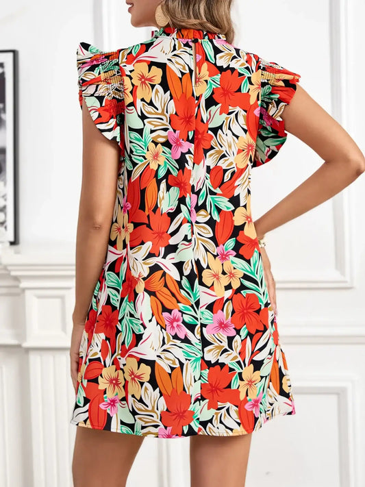 Vibrant floral dress with ruffled sleeves and bold tropical print for stylish everyday wear