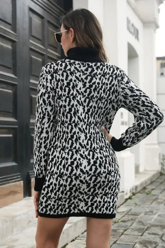 Rear view of a woman wearing a black and white leopard print knit mini dress