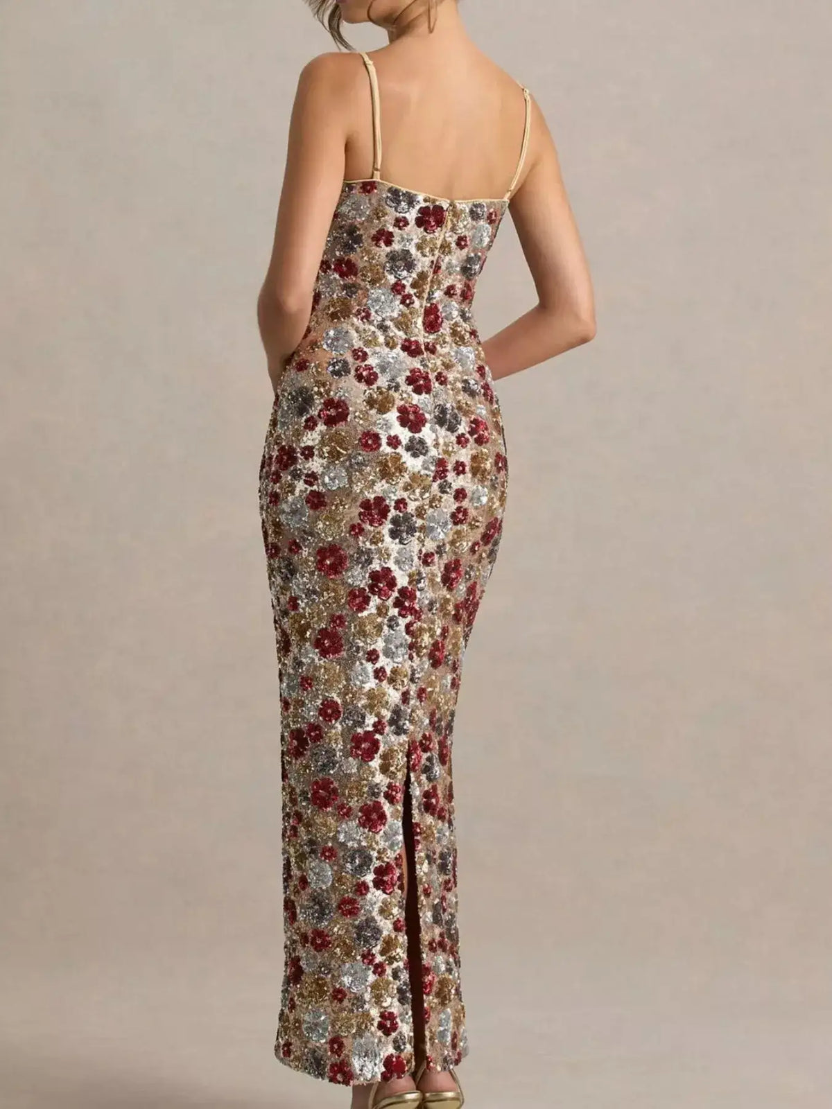 Back view of Evie's Dreamland floral sequin bodycon maxi dress with thin straps and a back slit.