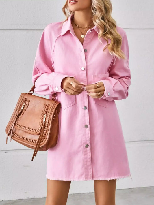 Woman wearing a pink button-down shirt dress with a brown handbag, casual fashion style