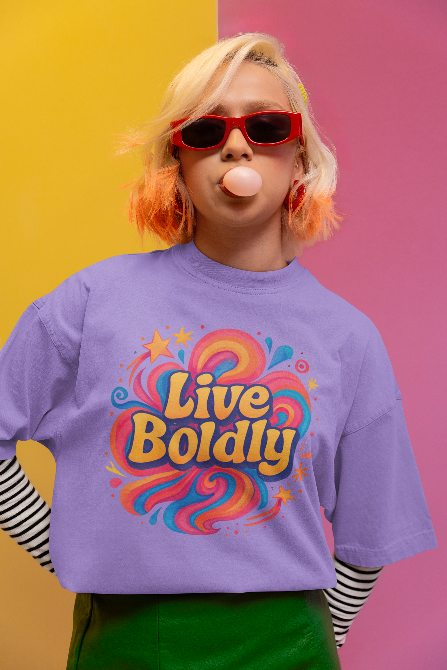 Person wearing a purple shirt with 'Live Boldly' design against a colorful background