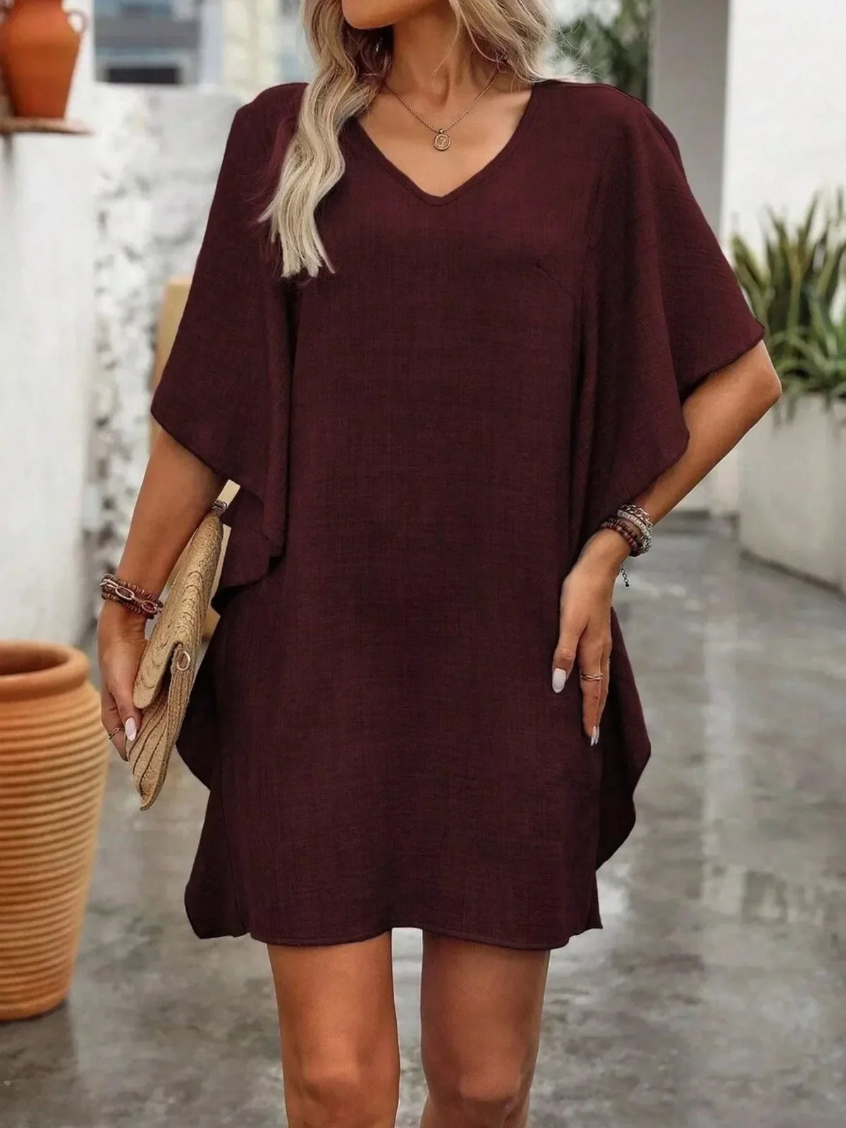 Flutter-sleeve V-neck mini dress with ruffle detail, front view
