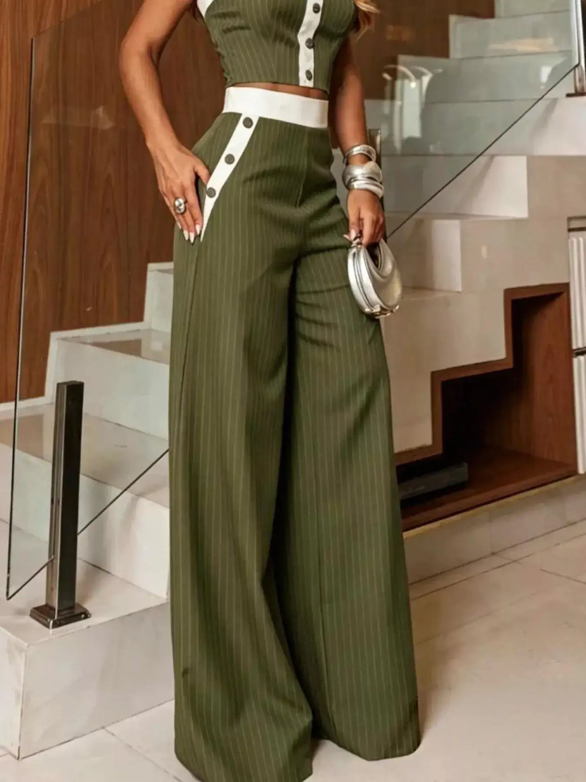 Evie's Dreamland olive green striped strapless crop top and wide-leg pants set with white button accents.