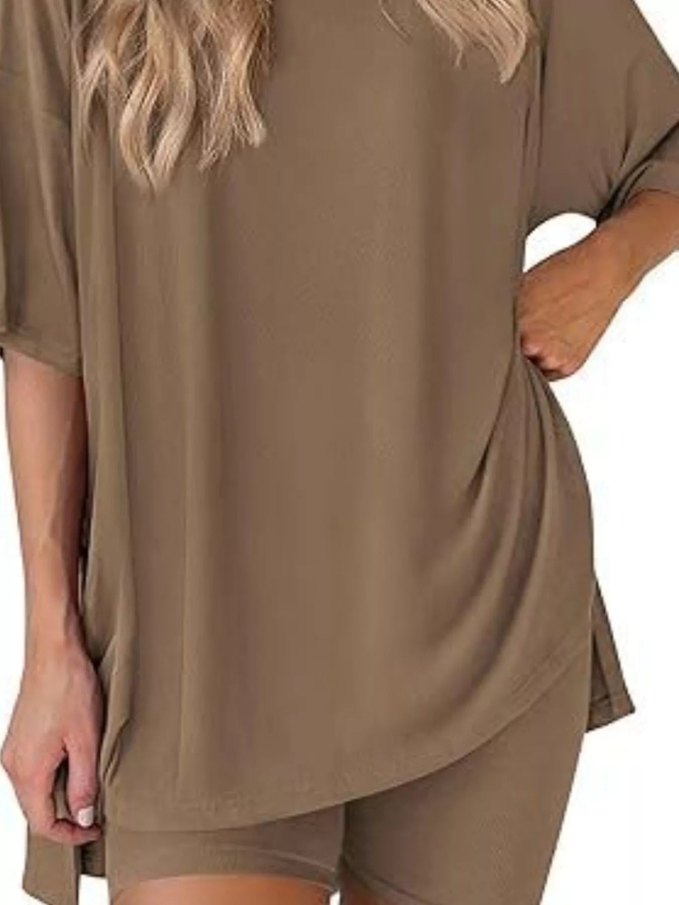 Woman wearing loose brown lounge set with oversized top and matching shorts, casual outfit