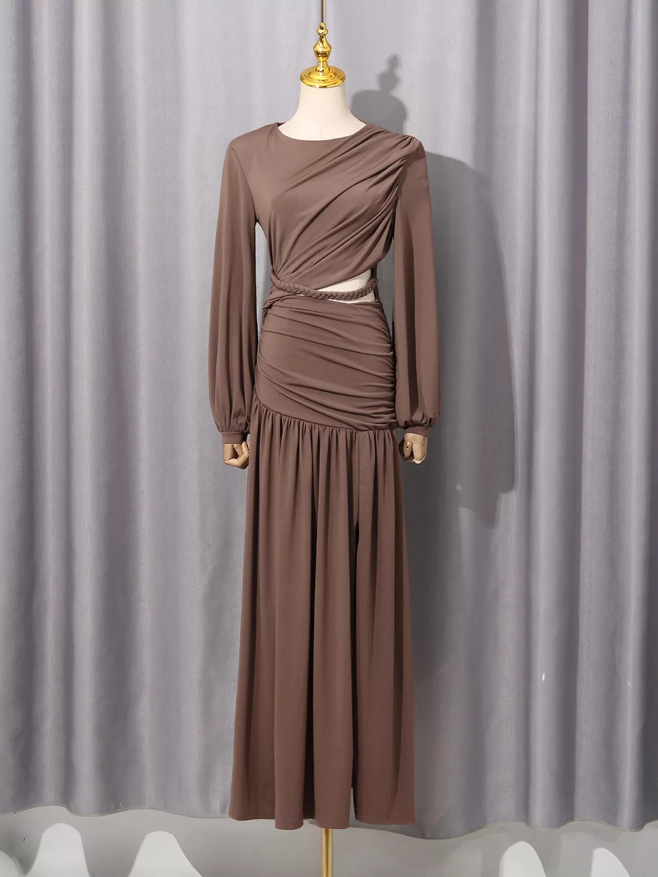 Taupe long sleeve cut-out maxi dress with ruched waist on a mannequin
