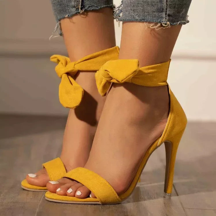 Women's strappy stiletto sandals in pink, high heel view
