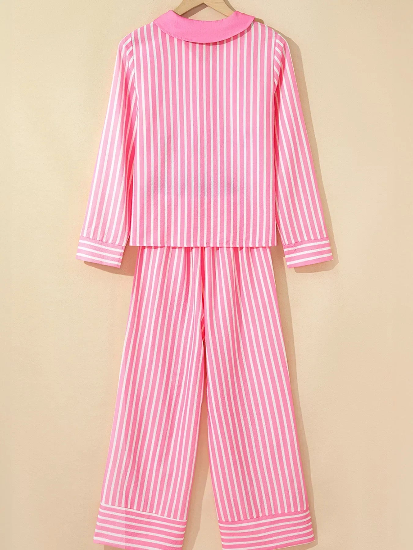 Pink and white vertical striped long-sleeve pajama set with collar and cuff details
