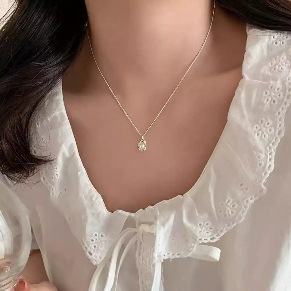 Freshwater pearl 925 sterling silver necklace worn with a white eyelet lace blouse from Evie's Dreamland.
