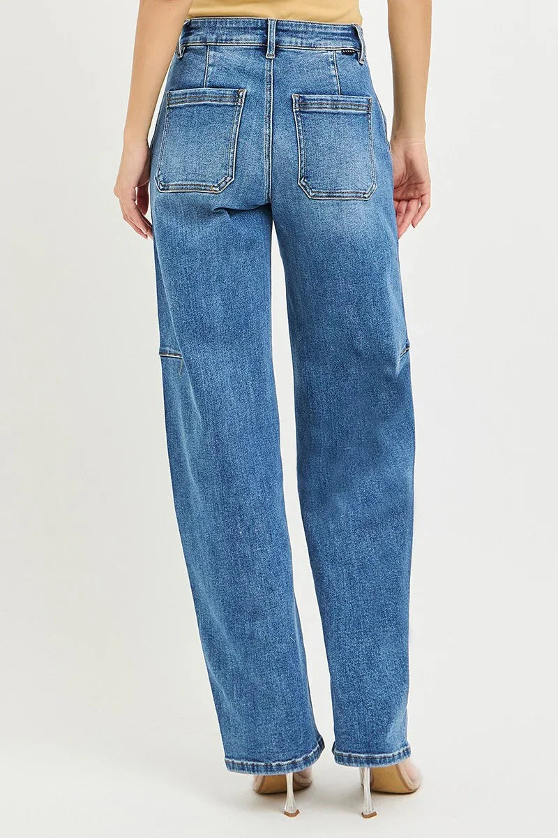 Back view of woman wearing high-waisted wide-leg blue jeans with large rear pockets