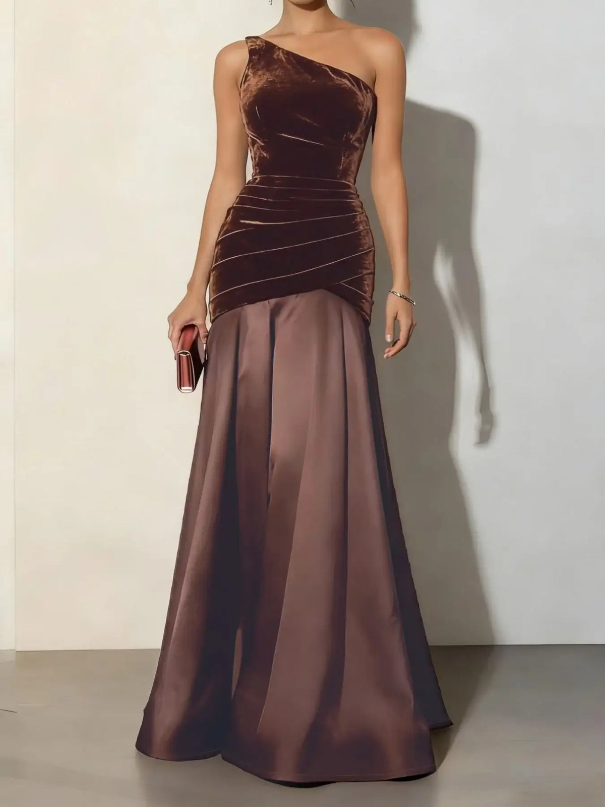 Brown one-shoulder mermaid maxi dress by Evie's Dreamland with ruched velvet bodice and satin skirt.
