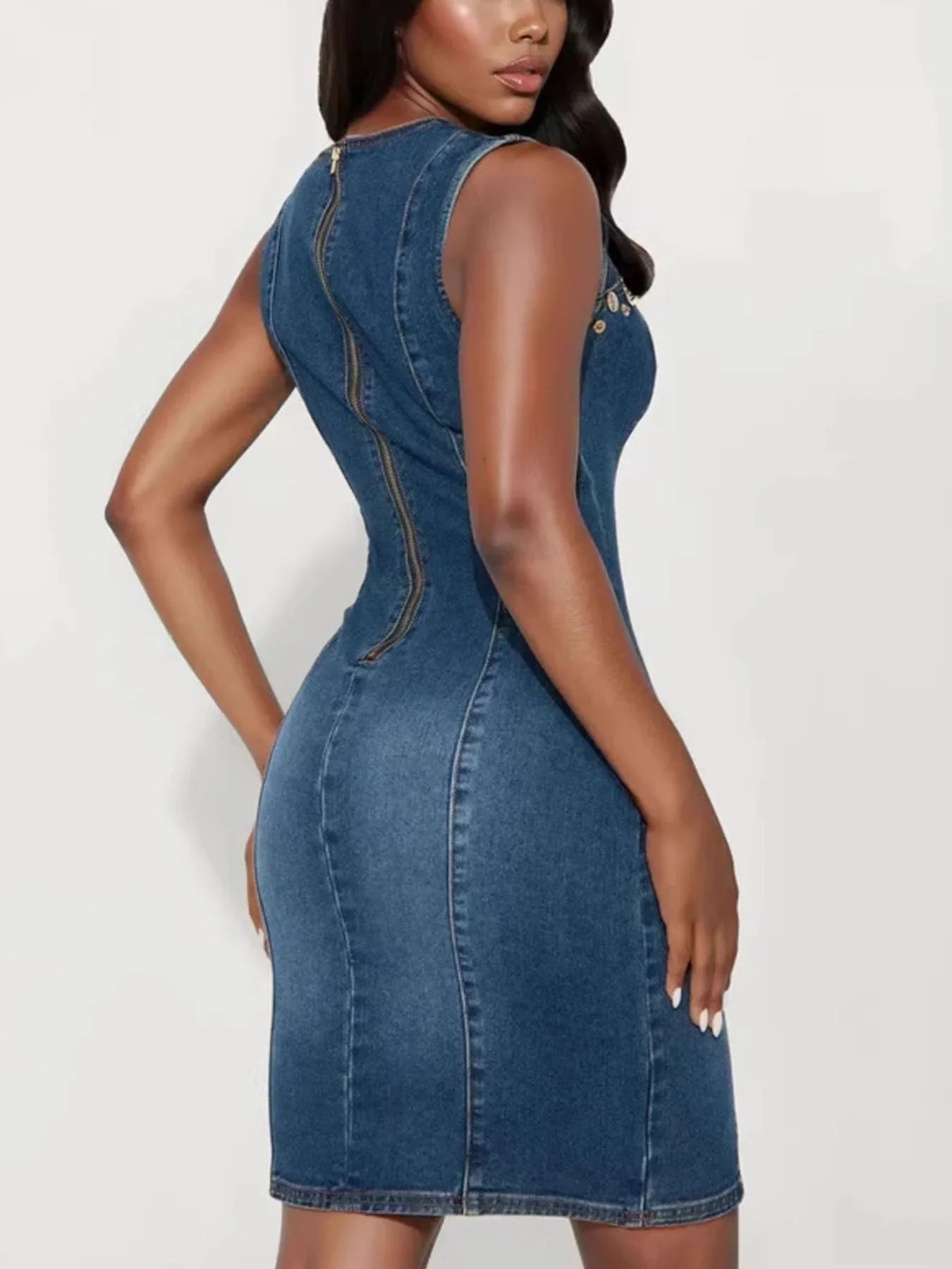 Woman wearing sleeveless denim bodycon dress with back zipper, stylish fashion outfit