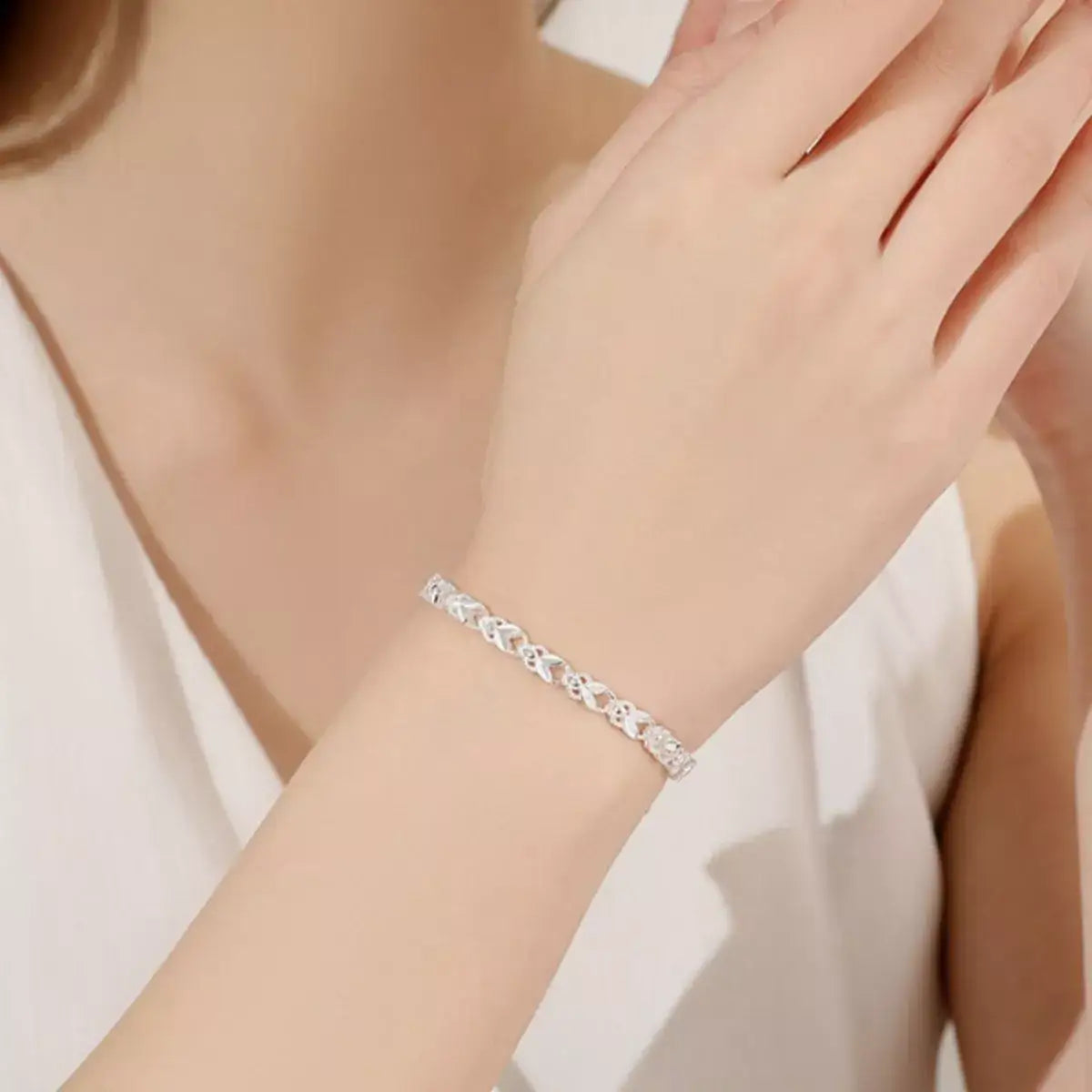 Women's 925 Sterling Silver chain bracelet with an intricate linked design worn on the wrist.