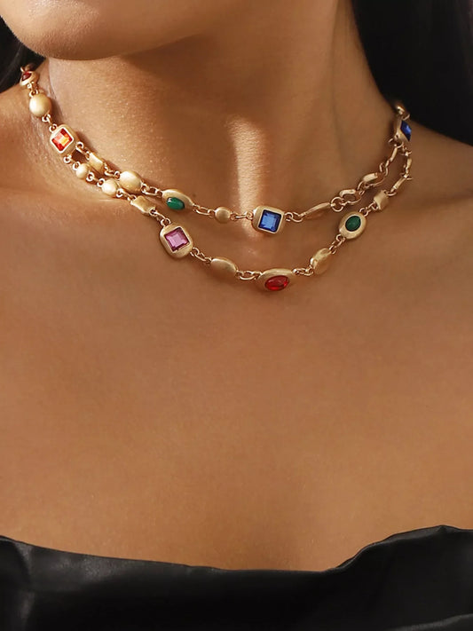Gold layered necklace with colorful gemstones, stylish fashion accessory for everyday elegance