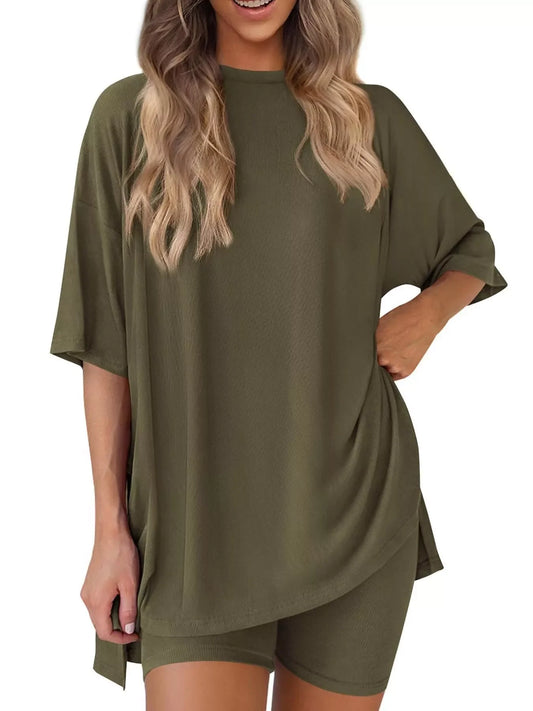 Woman wearing an olive green oversized t-shirt and matching biker shorts set