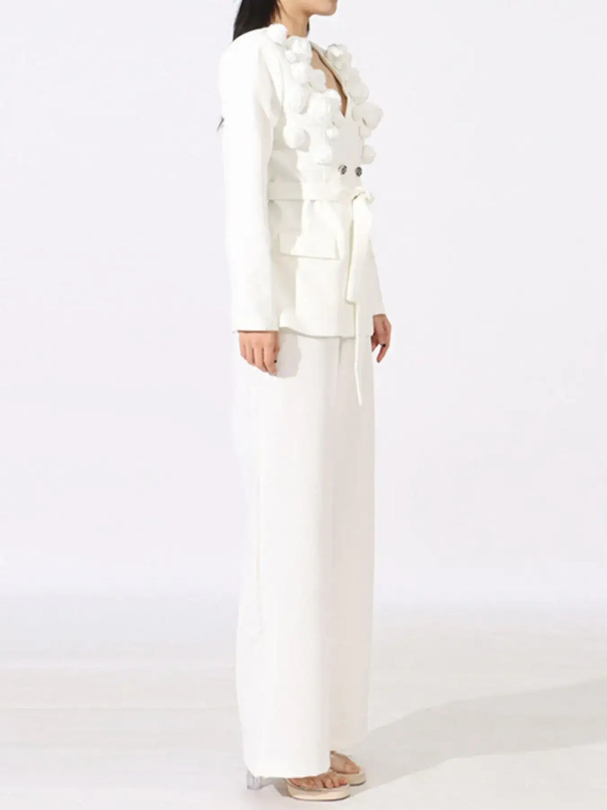 Evie's Dreamland white double-breasted blazer with 3D flowers and matching wide-leg pants.
