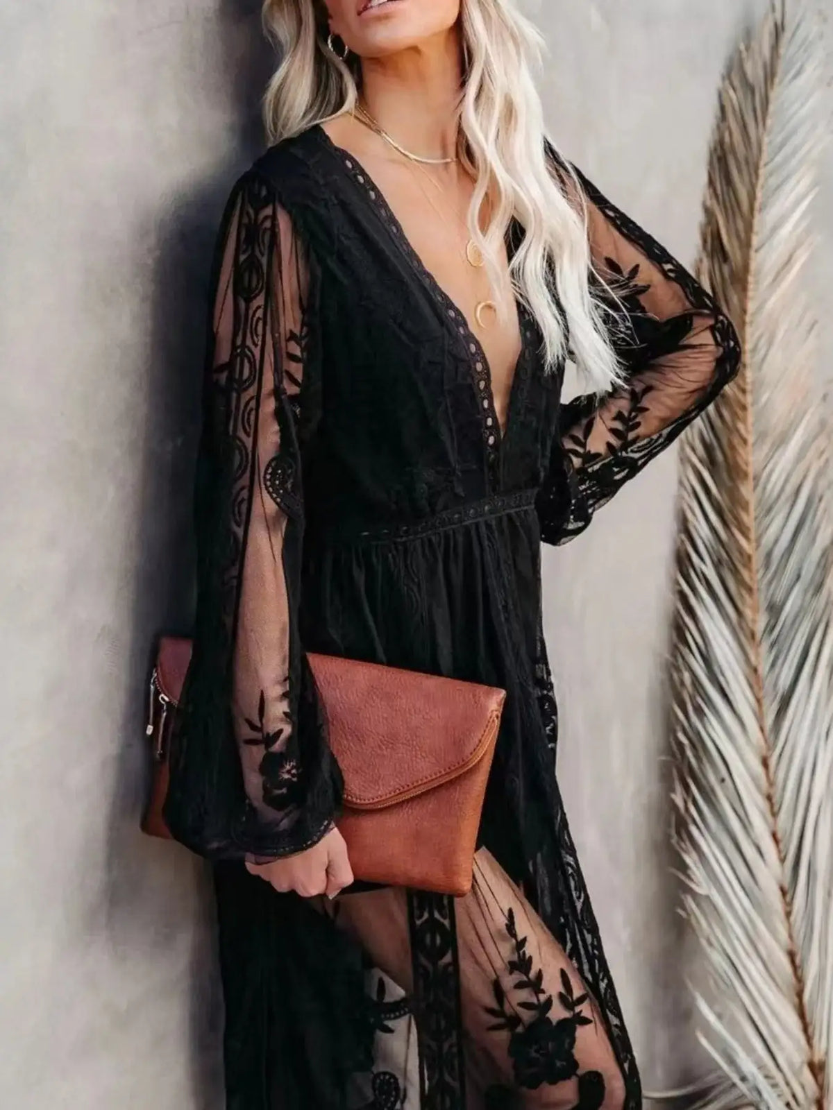 Woman wearing an elegant floral lace slit maxi dress from Evie's Dreamland