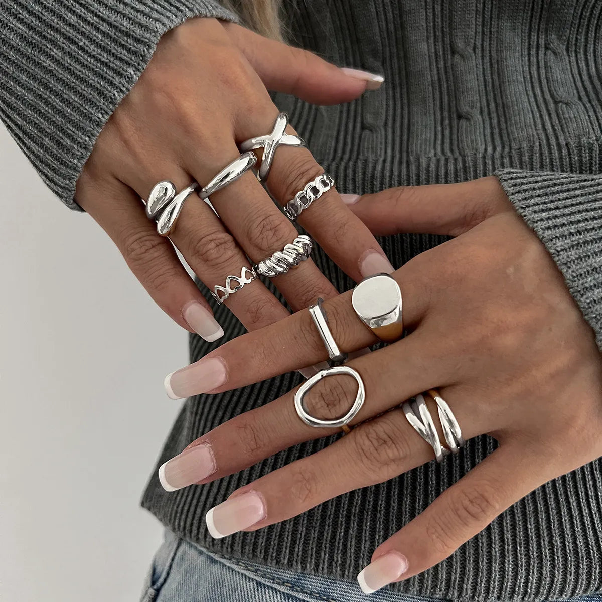 Stylish silver rings set on hands with elegant manicure, perfect for everyday fashion