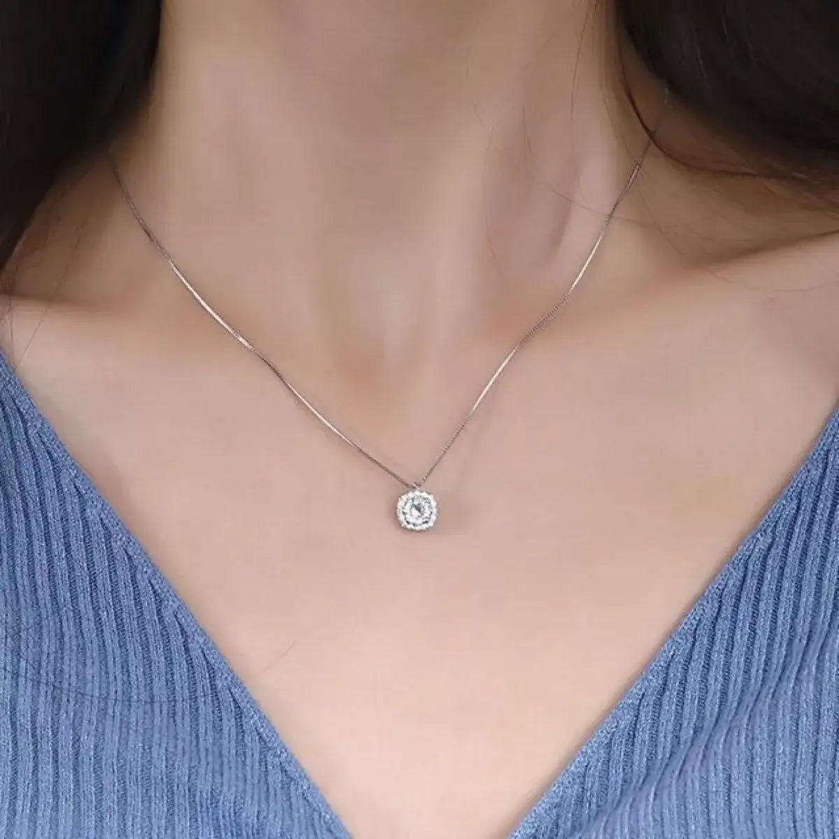 Woman wearing a 925 Sterling Silver Zircon pendant necklace from Evie's Dreamland.