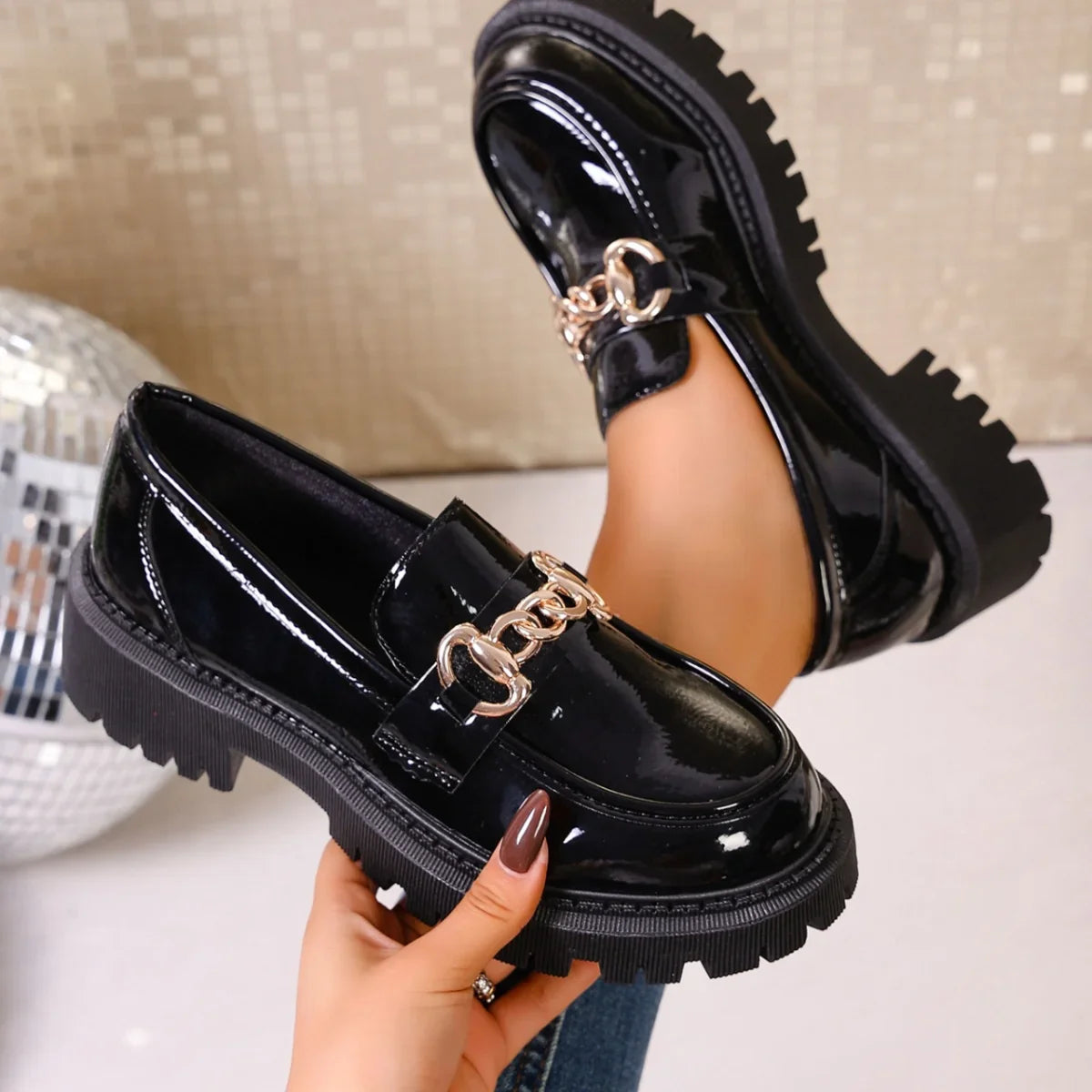 Top view of black chain decor slip-on loafers for women