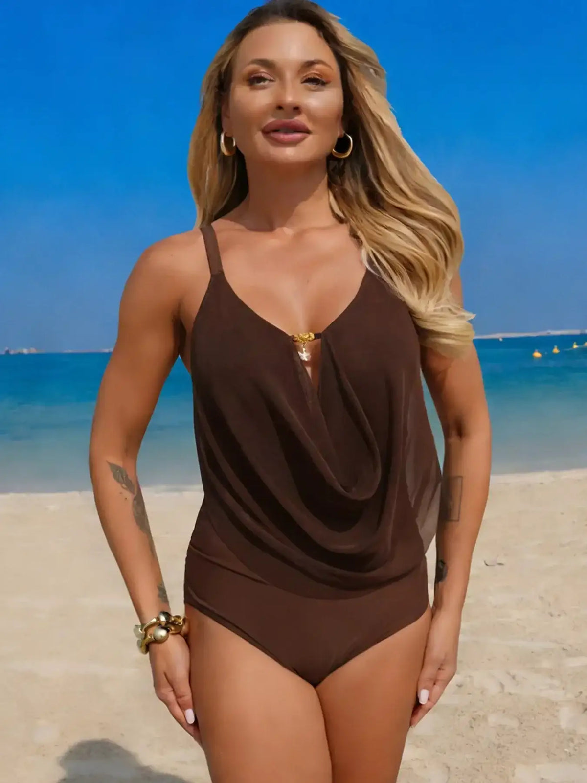 Solid color ruched one-piece swimsuit shown on a model.