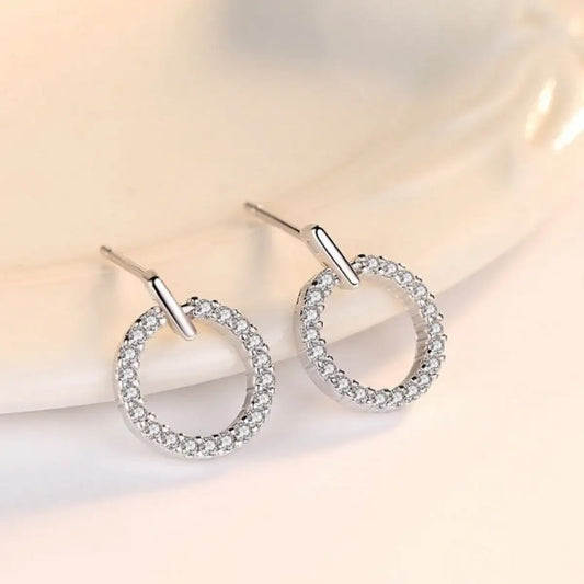 Evie's Dreamland 925 sterling silver circle stud earrings embellished with sparkling cubic zirconia crystals.