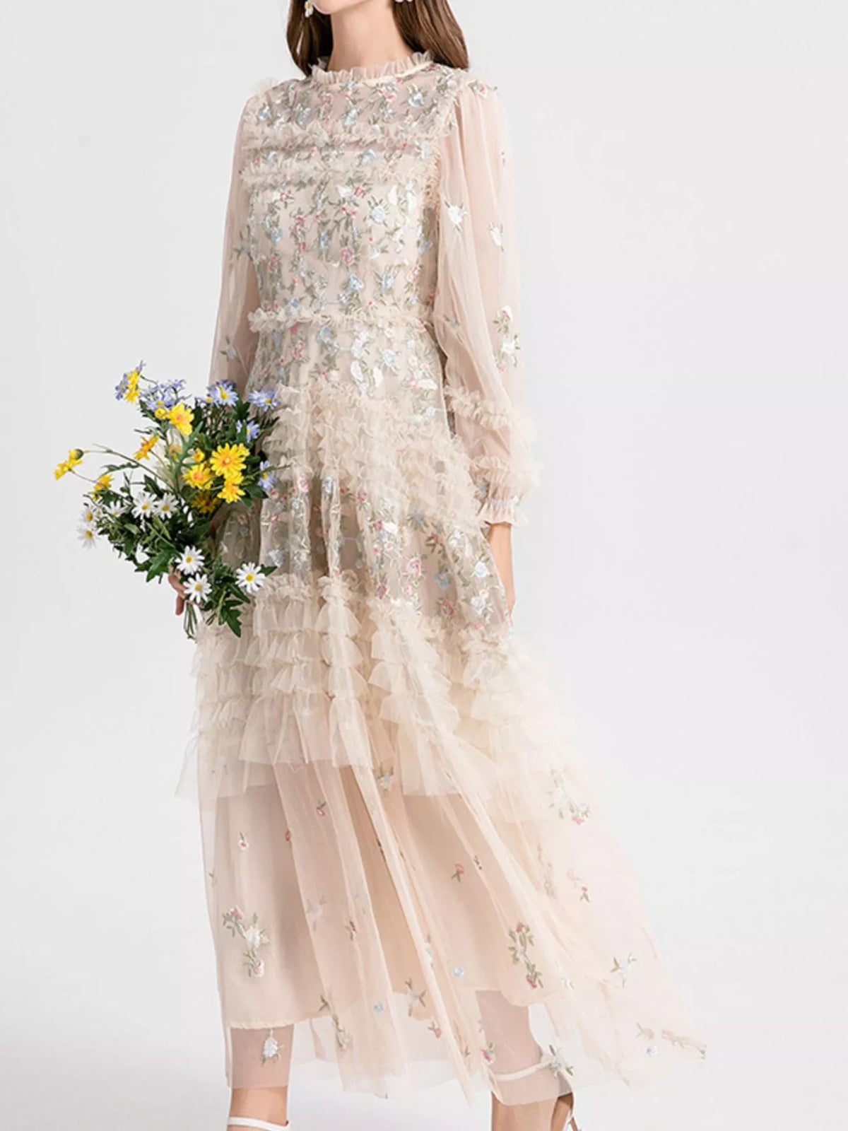 Woman in an apricot floral tulle maxi dress with embroidery by Evie's Dreamland