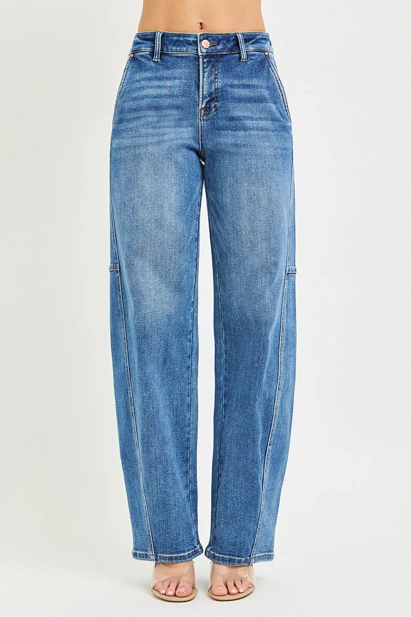 High-waisted wide-leg blue jeans with front seams, styled with sandals on a white background
