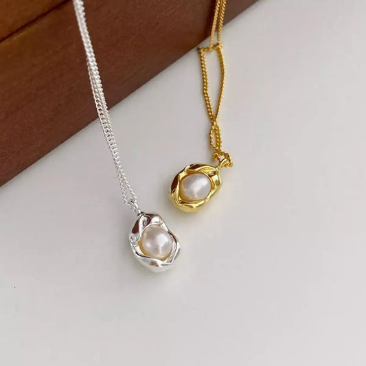 Evie's Dreamland freshwater pearl necklaces in sterling silver and gold with organic metal wraps.