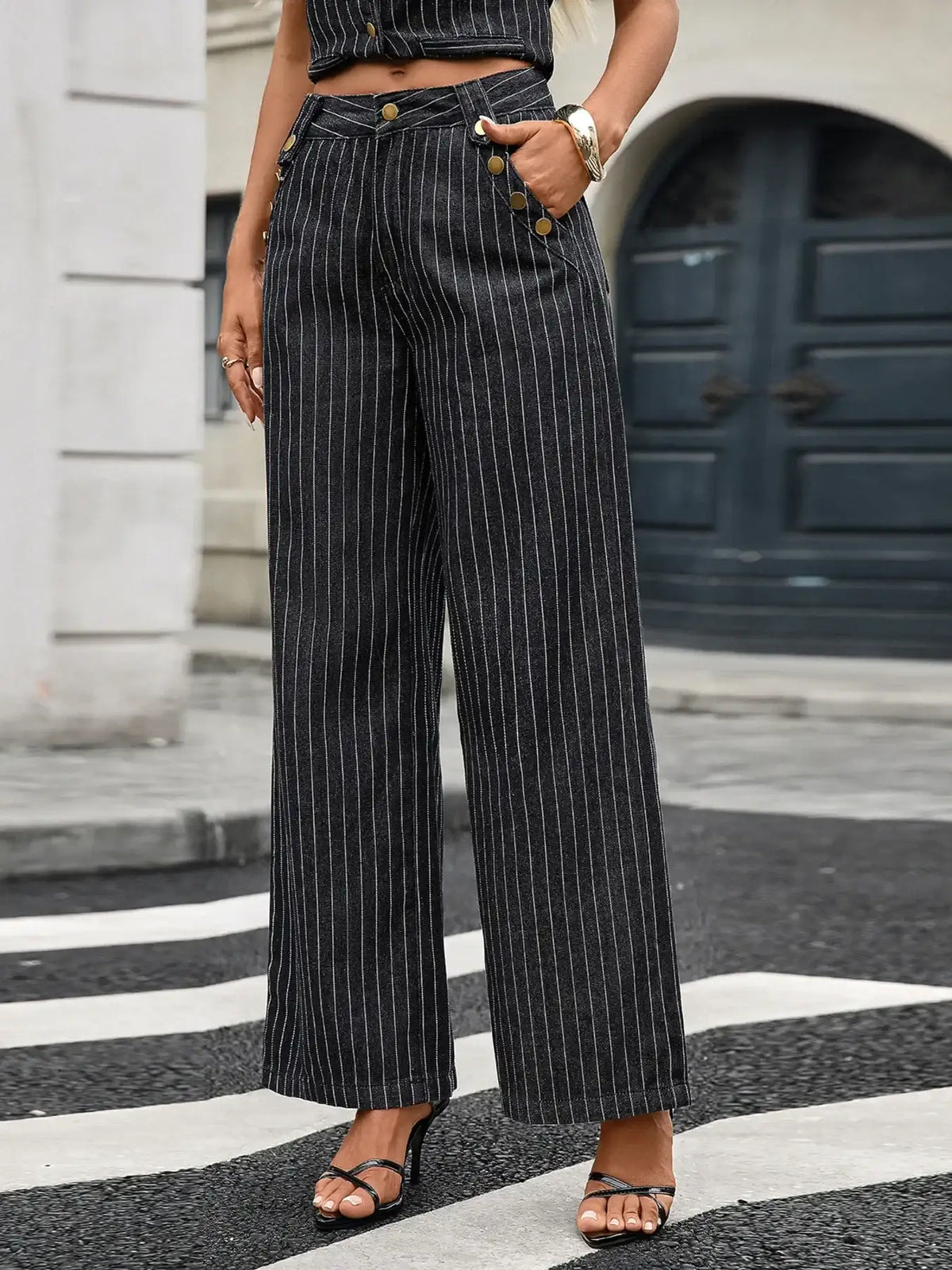 Women's black and white striped wide-leg denim trousers with gold button details by Evie's Dreamland.