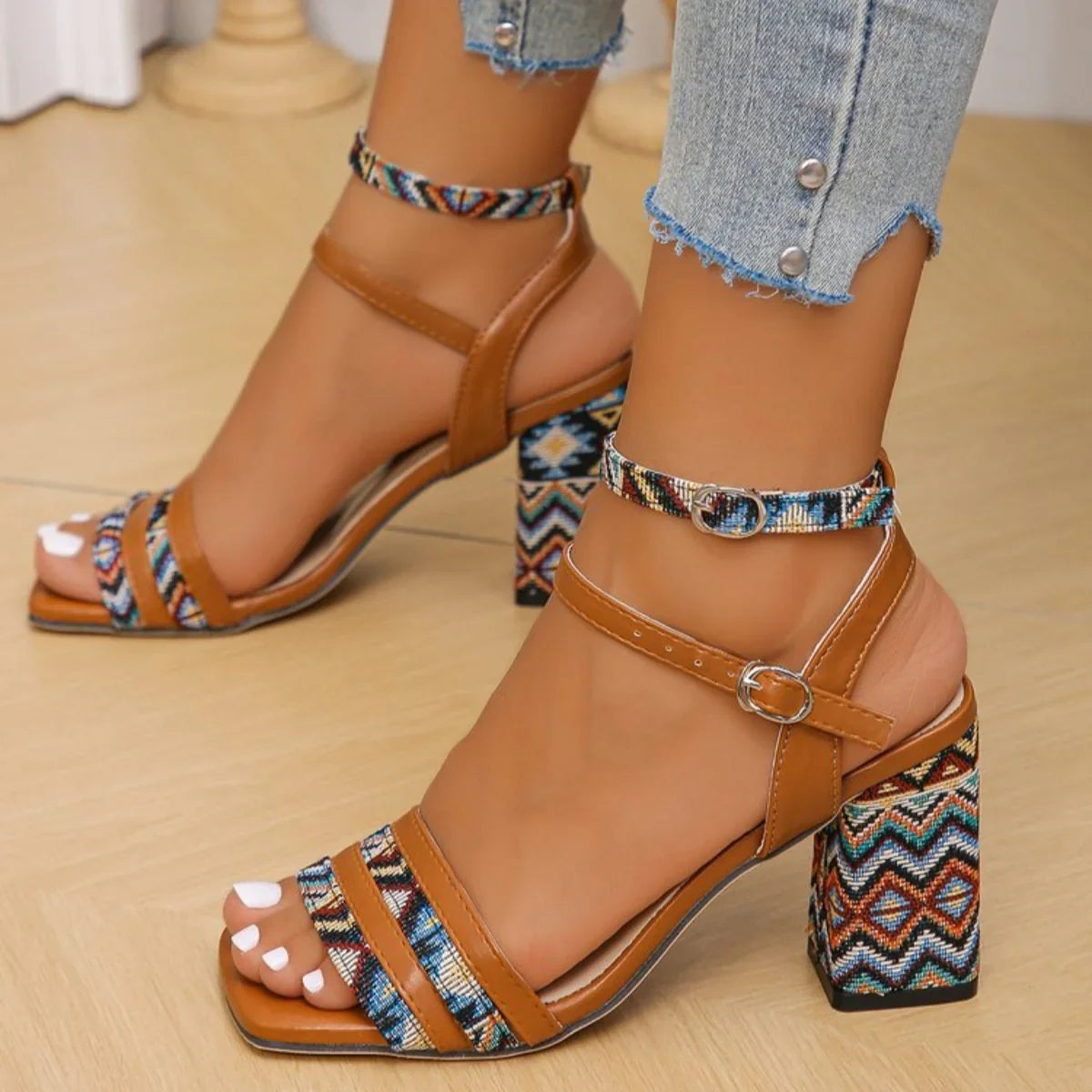 Close-up of block heel on women's light brown open toe sandals