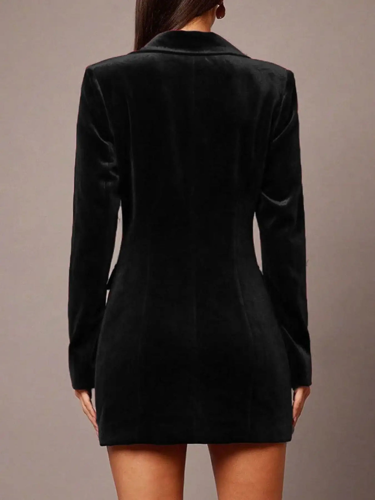 Back view of a black velvet double-breasted blazer dress by Evie's Dreamland with long sleeves and a slim fit.