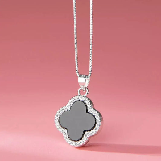 Evie's Dreamland 925 sterling silver clover pendant necklace with a black center and crystal border.