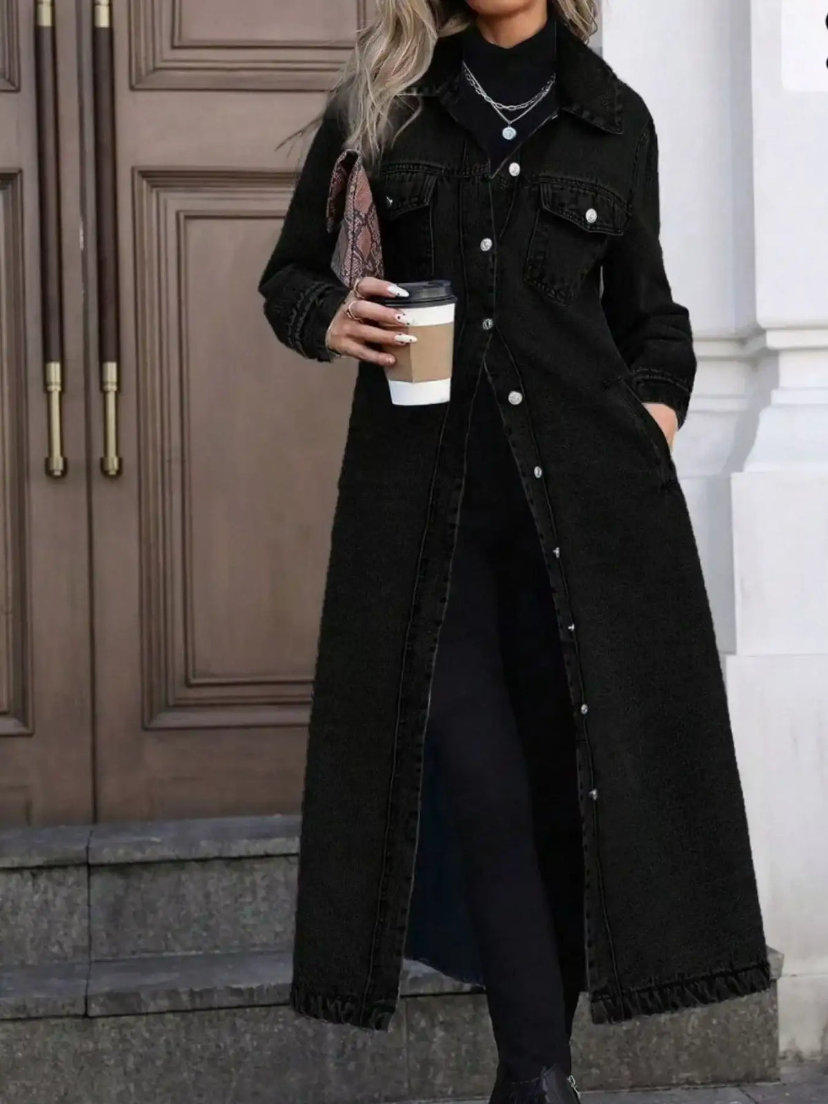 Women's black longline denim jacket by Evie's Dreamland with button-front closure and a relaxed fit.