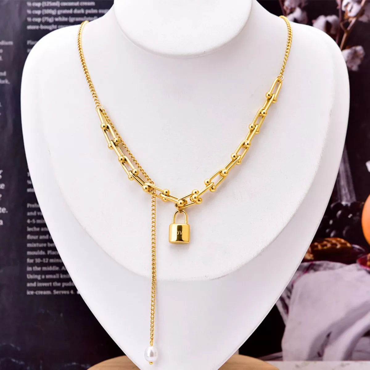 Gold chain necklace with lock pendant and pearl drop, elegant everyday fashion accessory