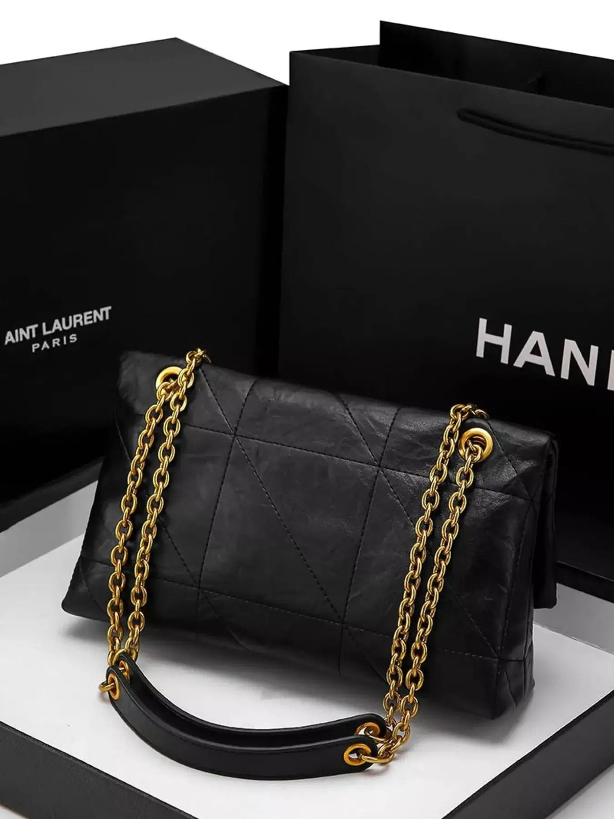 Black geometric quilted PU leather shoulder bag by Evie's Dreamland with a gold chain strap.