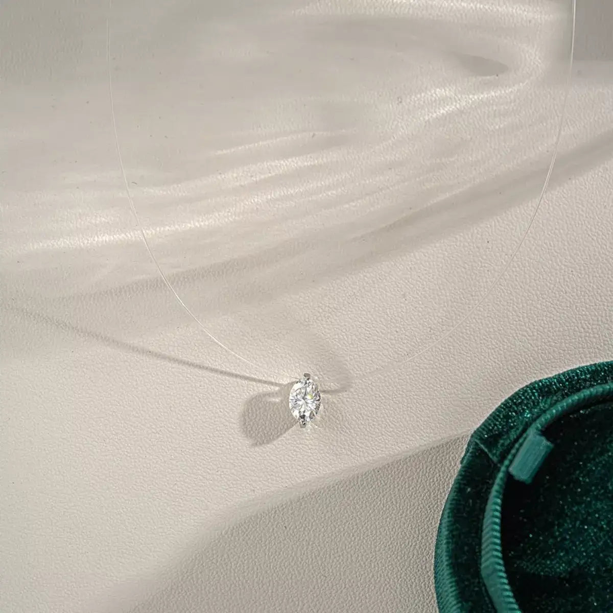 925 Sterling Silver Moissanite Pendant Necklace by Evie's Dreamland on a transparent floating cord.