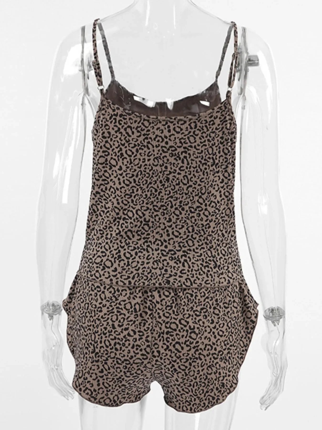 Leopard print women's romper with adjustable spaghetti straps on clear mannequin