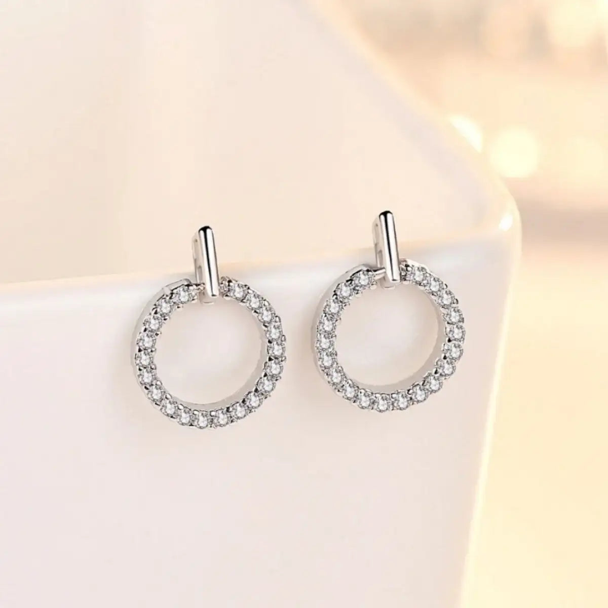 Evie's Dreamland 925 sterling silver circle stud earrings encrusted with sparkling cubic zirconia.